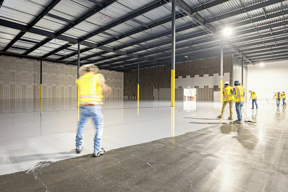 Construction crew working inside a large commercial building